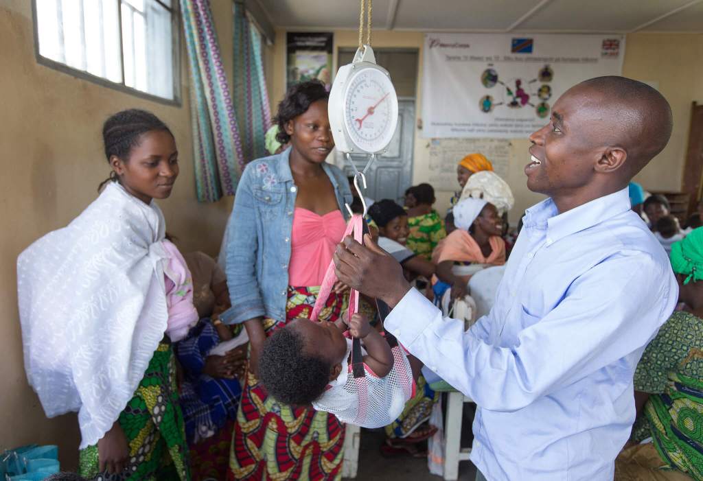 baby getting weighed at health center