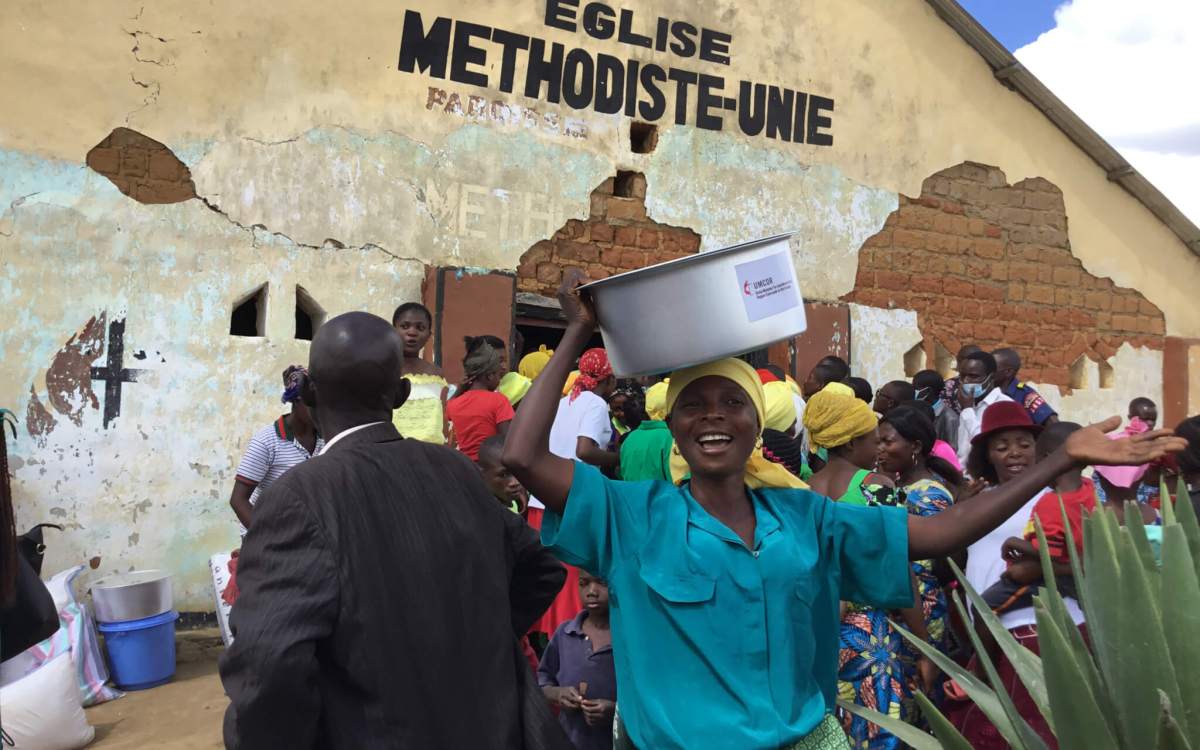 relief packages being distributed in a flooded area in DRC